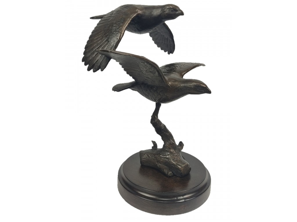 Bronce de pareja perdices volando del autor Lucio Relaño