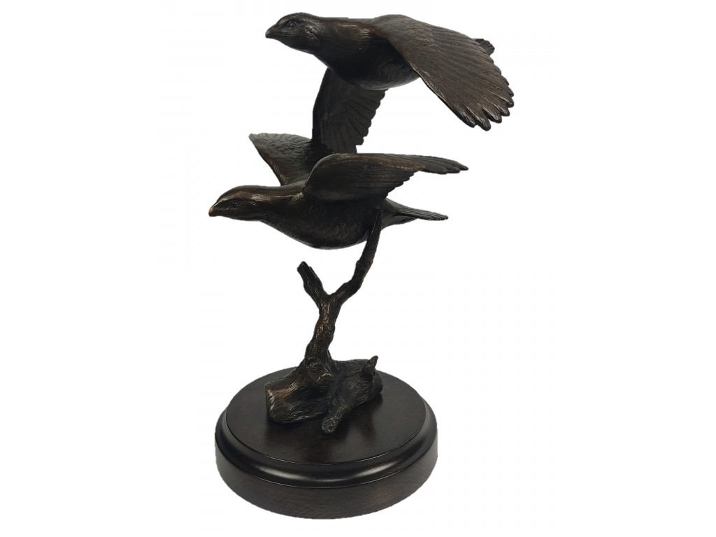 Bronce de pareja perdices volando del autor Lucio Relaño