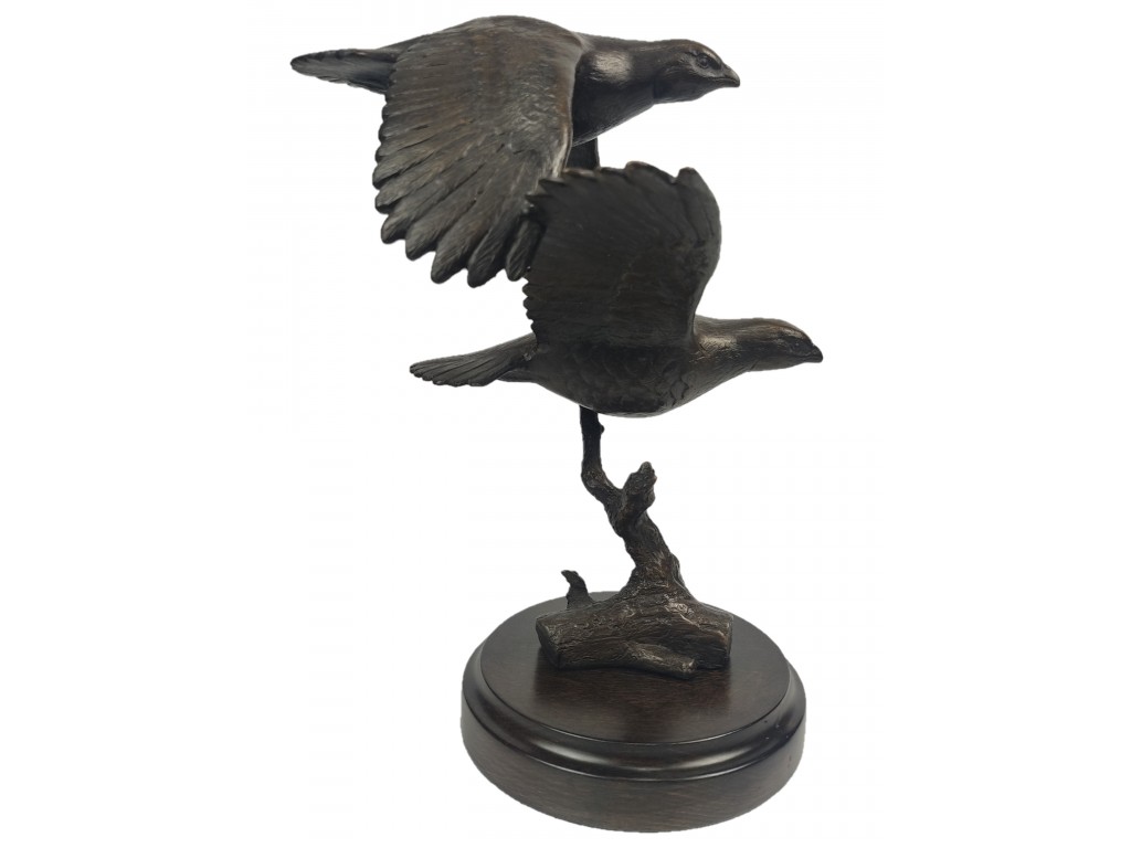 Bronce de pareja perdices volando del autor Lucio Relaño