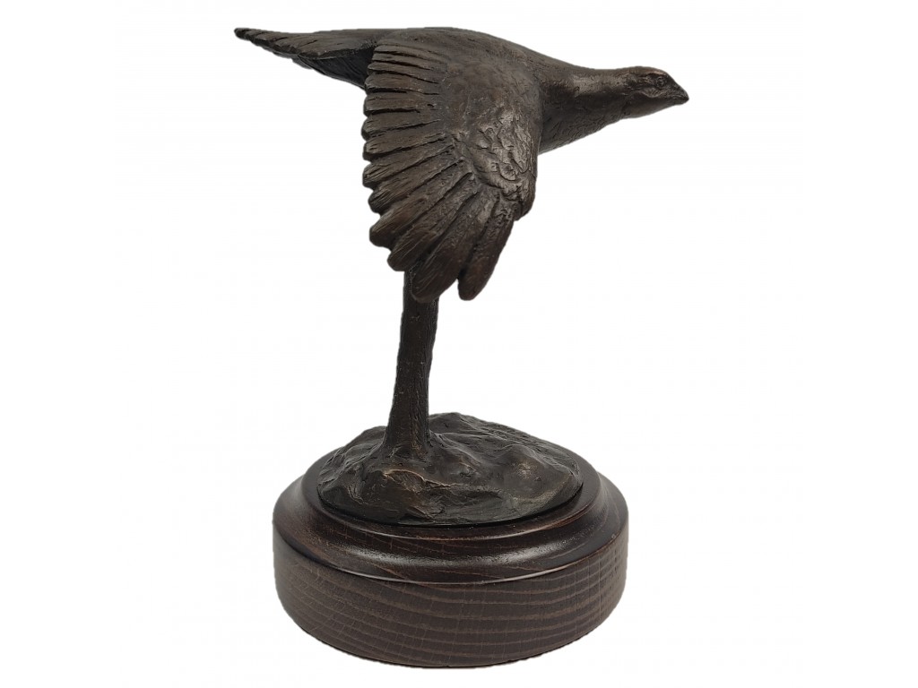 Bronce pequeño de perdiz volando del autor Lucio Relaño