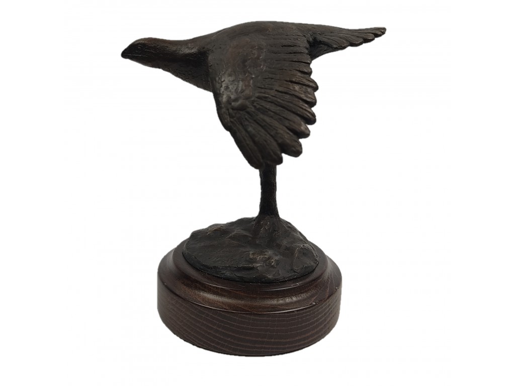 Bronce pequeño de perdiz volando del autor Lucio Relaño